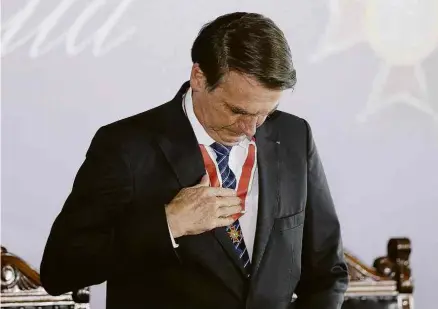  ?? Pedro Ladeira - 15.ago.2019/Folhapress ?? O presidente Jair Bolsonaro na cerimônia de entrega de medalhas do Mérito Mauá, na última quinta
