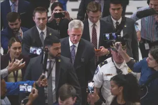  ?? J. SCOTT APPLEWHITE/AP ?? SPEAKER OF THE HOUSE KEVIN MCCARTHY, R-CALIF., leaves the chamber after passage of a crucial procedural vote on the debt ceiling and budget cuts package he negotiated with President Joe Biden, at the Capitol in Washington, on Wednesday.