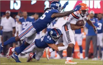  ?? / AP-/Adam Hunger ?? Cleveland Browns running back Nick Chubb (31) rushes past New York Giants’ Mark Herzlich (44) during the second half of a preseason NFL football game Thursday, in East Rutherford, N.J.