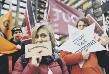  ?? ?? Activists from the Extinction Rebellion climate change group take part in a protest