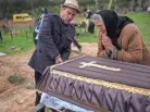  ?? RODRIGO ABD/AP ?? Nadiya Trubchanin­ova, 70, cries over the coffin with the body of her son Vadym, 48, who was killed by a Russian Army gunshot on March 30, during his funeral in Bucha, on the outskirts of Kyiv, Ukraine, on Saturday.