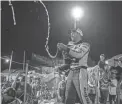  ?? DAVE KALLMANN / MILWAUKEE JOURNAL SENTINEL ?? A tired Ty Majeski sprays champagne after winning the 41st Slinger Nationals on Wednesday night.