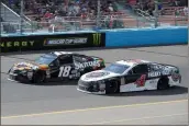  ?? Rick Scuteri / AP ?? NASCAR Cup Series driver Kevin Harvick (4) passes Kyle Busch on lap 131 during Sunday’s race in Avondale, Ariz.