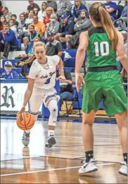 ?? Courtney Couey, Ringgold Tiger Shots ?? Ringgold senior Maggie Reed looks to drive the lane during last week’s game with Murray County. Reed would draw a foul and hit two free throws with just over a second remaining to break a tie and lift the Lady Tigers to a 53-51 victory.