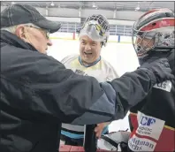  ?? JASON MALLOY/THE GUARDIAN ?? Queens County Oldtimers coach Everett White, from left, speaks with Kings County Oldtimers goalie Sean Gracey and Queens County Oldtimers goalie Cam Beach.