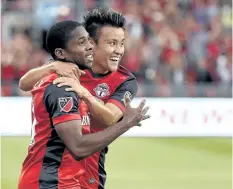  ?? THE CANADIAN PRESS ?? Toronto FC’s midfielder Armando Cooper, left, celebrates an assist with teammate Tsubasa Endoh in this file photo.