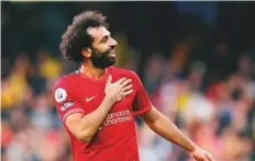  ?? Reuters ?? Liverpool’s Mohammad Salah celebrates scoring their fourth goal against Watford at Vicarage Road yesterday.