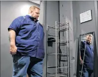  ?? JEFF ROBERSON/THE ASSOCIATED PRESS ?? In this Sept. 24 photo, comedian Chris Cyr stands in a green room as he waits to go on stage at Helium comedy club in Richmond Heights, Mo. Cyr has found that fashion for plus-sized men has improved over the past few years.