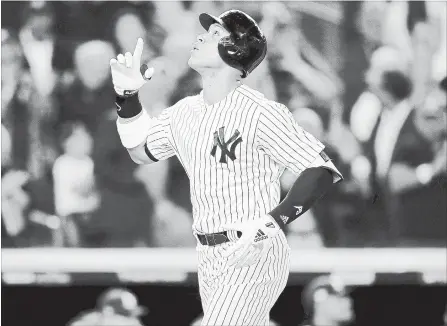  ?? ELSA GETTY IMAGES ?? New York Yankees’ Aaron Judge celebrates a two-run home run against Liam Hendriks of the Oakland Athletics on Wednesday night in New York.