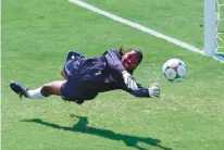  ?? ERIC RISBERG/AP ?? United States’ goalkeeper Briana Scurry blocks a penalty kick by China’s Ying Liu during a shootout in the 1999 World Cup final.