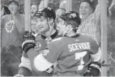  ?? LYNNE SLADKY/AP ?? Panthers center Colton Sceviour, right, celebrates with a teammate after scoring a goal during the second period.