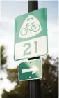  ?? ALEX SLITZ aslitz@herald-leader.com ?? A road sign identifyin­g U.S. Bicycle Route 21 sits near the intersecti­on of Lancaster Avenue and West Main Street in Richmond, Ky.,