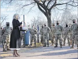  ?? Jacquelyn Martin The Associated Press ?? First lady Jill Biden surprises National Guard members outside the Capitol with chocolate chip cookies Friday. President Joe Biden expressed his “dismay” Friday morning to the chief of the National Guard about how the troops had been treated.