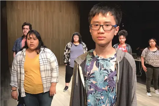  ?? DAVID FEINER ?? Phong Nguyen ( front) and other Albany Park Theater Project ensemble members rehearse for the premiere of “Ofrenda.”