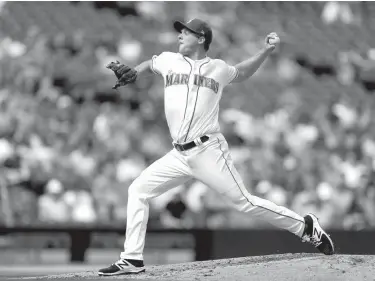  ?? Associated Press ?? n Seattle Mariners starting pitcher Andrew Albers throws against the Oakland Athletics in the fourth inning of a baseball game Sunday in Seattle.