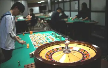  ??  ?? A student practising the game of roulette at the Japan Casino School in Tokyo. Japan has long been viewed as the Holy Grail of gaming in Asia due to a wealthy population, proximity to China and appetite for many forms of legal gambling. — AFP photos