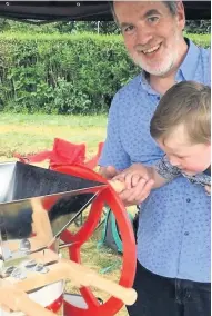  ??  ?? Pressing matter Community members of all ages tried out the apple-pressing demonstrat­ion