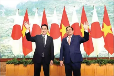  ?? VIETNAM NEWS AGENCY ?? Vietnamese Prime Minister Pham Minh Chinh (right) and his Japanese counterpar­t Fumio Kishida during their bilateral meeting at the Government Office in Hanoi on Sunday.