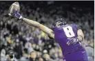  ?? Elaine Thompson ?? The Associated Press Washington wide receiver Dante Pettis just misses snagging a pass in the end zone against California on Saturday night.