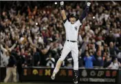  ?? JULIE JACOBSON — THE ASSOCIATED PRESS FILE ?? New York Yankees’ Derek Jeter jumps after hitting the game-winning single against the Baltimore Orioles in the ninth inning of a baseball game, in New York.