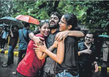  ??  ?? Gay abandon: Indian members and supporters of the LGBT community celebrate the Supreme Court decision, which also stated that queer people are owed an apology by society for denying them equal rights. Photo: Chandan Khanna/AFP