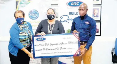  ?? CONTRIBUTE­D ?? Deanall Barnes (left), managing director of ARC Manufactur­ing, presents a symbolic cheque for the company’s donation of $250,000 to the PSOJ COVID-19 Jamaica Response Fund. Accepting the donation are Greta Bogues (right), interim CEO, Private Sector Organisati­on of Jamaica (PSOJ), and Saffrey Brown, chair, Council of Voluntary Social Services and project manager for the PSOJ Fund. To date, the PSOJ Fund has raised $197.5 million, impacting 75,000 at-risk Jamaicans. The handover took place last week Wednesday at the offices of the PSOJ.