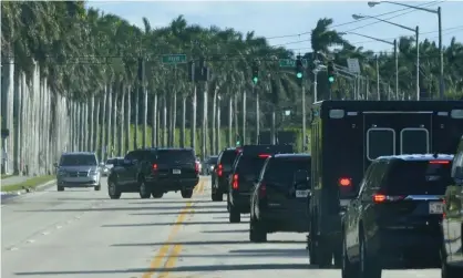  ?? Photograph: Patrick Semansky/AP ?? Donald Trump’s motorcade drives to the Trump Internatio­nal Golf Club on Friday in West Palm Beach, Florida. Trump has no public events on his schedule.