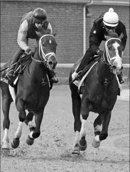  ?? BARBARA D. LIVINGSTON ?? Battalion Runner (right) disappoint­ed in his half-mile work.