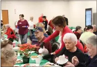  ?? PHOTO COURTESY OF SHANNON OMLOR OF ST. JOHN’S EVANGELICA­L LUTHERAN CHURCH, BOYERTOWN ?? Volunteers helped serve a free meal on Christmas Day in Fellowship Hall at St. John’s Evangelica­l Lutheran Church in Boyertown.