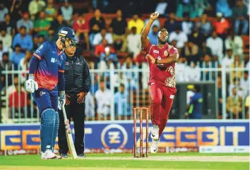  ?? Ahmed Ramzan/Gulf News ?? Andre Russell of Northern Warriors bowls against Maratha Arabians during the T10 League at Sharjah Internatio­nal Cricket Stadium on Sunday.