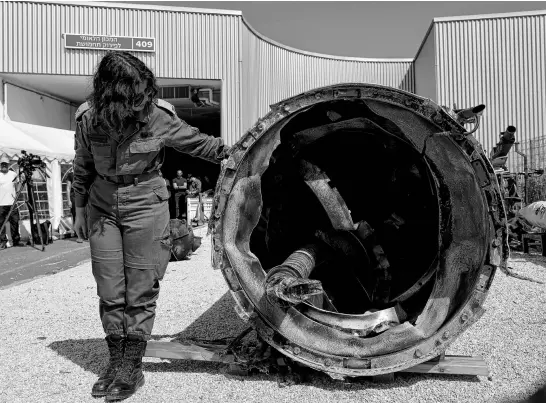  ?? REUTERS ?? Israel’s military displays what they say is an Iranian ballistic missile which they retrieved from the Dead Sea after Iran launched drones and missiles toward Israel, at Julis military base in southern Israel, on April 16.