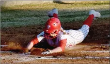  ?? MARK HUMPHREY ENTERPRISE-LEADER ?? Farmington senior shortstop Shayley Treat slides into home scoring a run during the Lady Cardinals’ 12-10 season-opening nonconfere­nce softball victory over Fort Smith Northside on Tuesday, March 2.