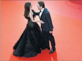  ?? Nicholas Hunt EPA-EFE /REX /Shuttersto­ck ?? PENELOPE CRUZ and Javier Bardem hit the Cannes red carpet Tuesday ahead of the screening of their film “Everybody Knows” by director Asghar Farhadi.