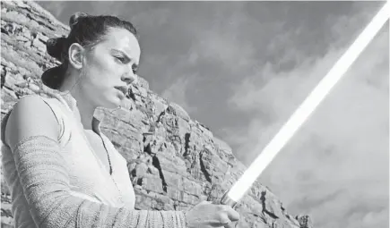  ??  ?? Heroic Rey (Daisy Ridley) is no slouch with a lightsaber in “Star Wars: The Last Jedi.” PHOTOS BY LUCASFILM