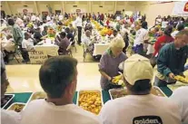  ?? ORLANDO SENTINEL FILE ?? This is what the annual Helpings from the Heart Thanksgivi­ng meal looked like in 2010, when it served over 20,000 people.