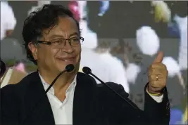  ?? FERNANDO VERGARA — THE ASSOCIATED PRESS ?? Presidenti­al candidate Gustavo Petro, with the Historical Pact coalition, gives a thumbs up to supporters on election night in Bogota, Colombia, Sunday.