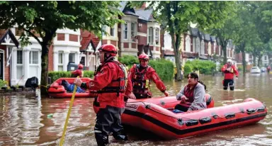  ??  ?? Floods: Residents in Birmingham had to be rescued from their homes by boat