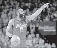  ?? Craig Mitchelldy­er Associated Press ?? JAMES HARDEN has been a man on fire lately, putting up big numbers while carrying the Rockets back into the hunt.