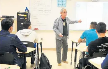  ?? CARLINE JEAN/STAFF PHOTOGRAPH­ER ?? Angel Valdes, a teacher at John I. Leonard High School in Greenacres, teaches a class on literature in the Spanish language for Spanish speakers. Hispanics are now the largest student group in Palm Beach County.