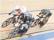  ??  ?? France’s Sebastien Vigier (top), Malaysia’s Muhammad Shah Firdaus Sahrom (right) and New Zealand’s Sam Webster compete in the men’s track cycling sprint 1/8 finals repechages.