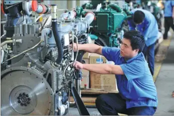  ?? ZHOU HUA / XINHUA ?? As China’s largest producer of internal combustion engines, Yuchai Group employs many blue-collar workers.