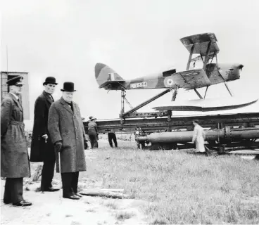  ??  ?? Winston Churchill, the United Kingdom’s wartime leader, visits the launch site of a de Havilland DH.82B Queen Bee target drone before it is catapulted into the air. Prior to his election to the post of prime minister, Churchill served as First Lord of the Admiralty.