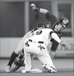  ?? AL DIAZ/TRIBUNE NEWS SERVICE ?? Miami Marlins shortstop Miguel Rojas (19) tags out the Tampa Bay Rays' Corey Dickerson trying to steal second base at Marlins Park in Miami on Tuesday.