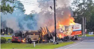  ?? FLORIDA HIGHWAY PATROL/ASSOCIATED PRESS ?? In this July 2, 2016, photo provided by the Florida Highway Patrol, a school bus carrying dozens of mostly Haitian migrant farmworker­s burns after being hit by a tractor-trailer in St. Marks, Fla. Police said the bus driver went through a flashing red...