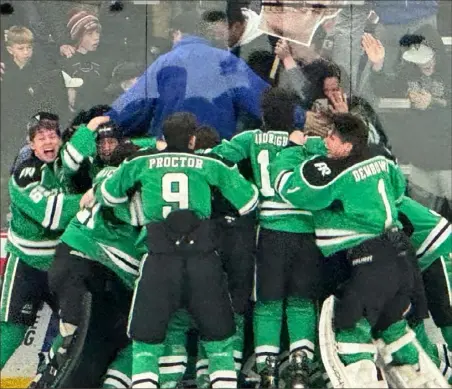  ?? Keith Barnes/Tri-State Sports & News Service ?? Pine-Richland players celebrate after A.J. Verszyla scored the game-winning goal at 7:07 of overtime Saturday to give the Rams the Pennsylvan­ia Cup Class 3A championsh­ip in Haverford, Pa. Pine-Richland defeated LaSalle, 5-4.