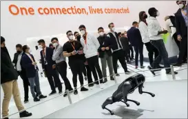  ?? ZHENG HUANSONG / XINHUA ?? A robotic dog developed by Chinese electronic­s giant Xiaomi on disply at Mobile World Congress in Barcelona, Spain, in March.