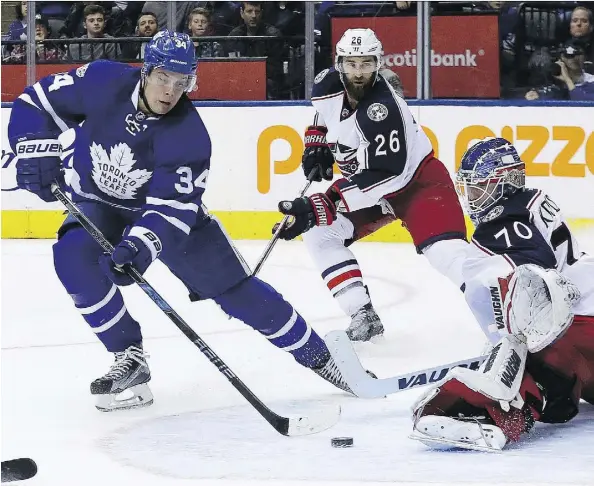  ?? DAVE ABEL ?? Toronto Maple Leafs centre Auston Matthews fires a shot in front of Columbus Blue Jackets goaltender Joonas Korpisalo on Sunday in Toronto. Matthews was held off the scoresheet Sunday, but the rookie finished his first NHL season with 40 goals and 69...