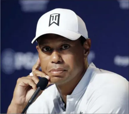  ?? DARRON CUMMINGS — THE ASSOCIATED PRESS ?? Tiger Woods listens during a news conference at the PGA Championsh­ip golf tournament at Bellerive Country Club, Tuesday in St. Louis.