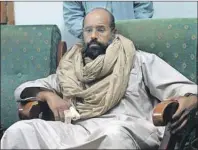  ?? AP PHOTO ?? Seif al-Islam is seen after his capture in the custody of revolution­ary fighters in Zintan, Libya, in November 2011. A court in the Libyan capital has sentenced al-Islam, Moammar Gadhafi’s son, to death over killings during the country's 2011 uprising.