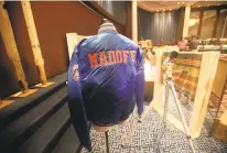  ?? MARIO TAMA/GETTY ?? A Bernard Madoff Mets jacket is displayed during a press preview of a U.S. Marshals Service auction of personal property seized from Bernard and Ruth Madoff on Nov. 13, 2009, in New York City.